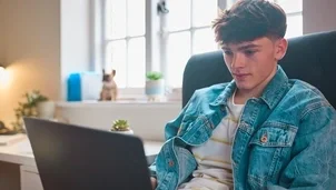 Boy on a laptop at home