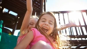 Two girls playing in the park