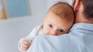 Man holding a baby
