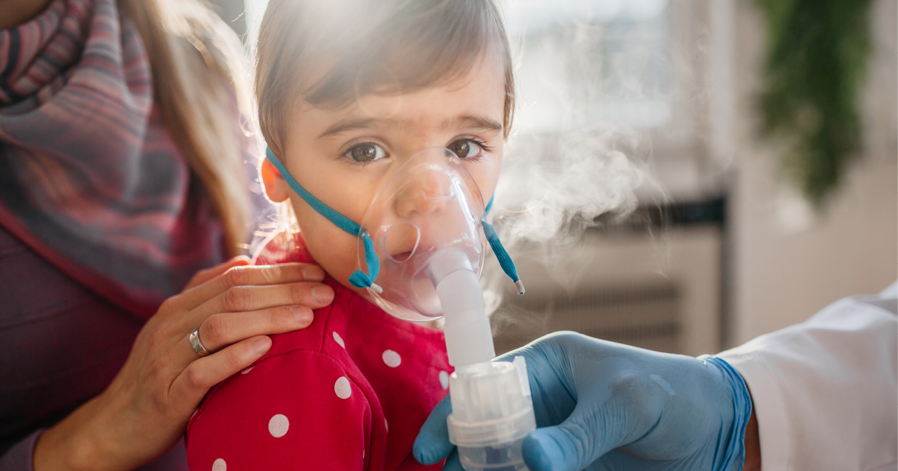 Child wearing an oxygen mask