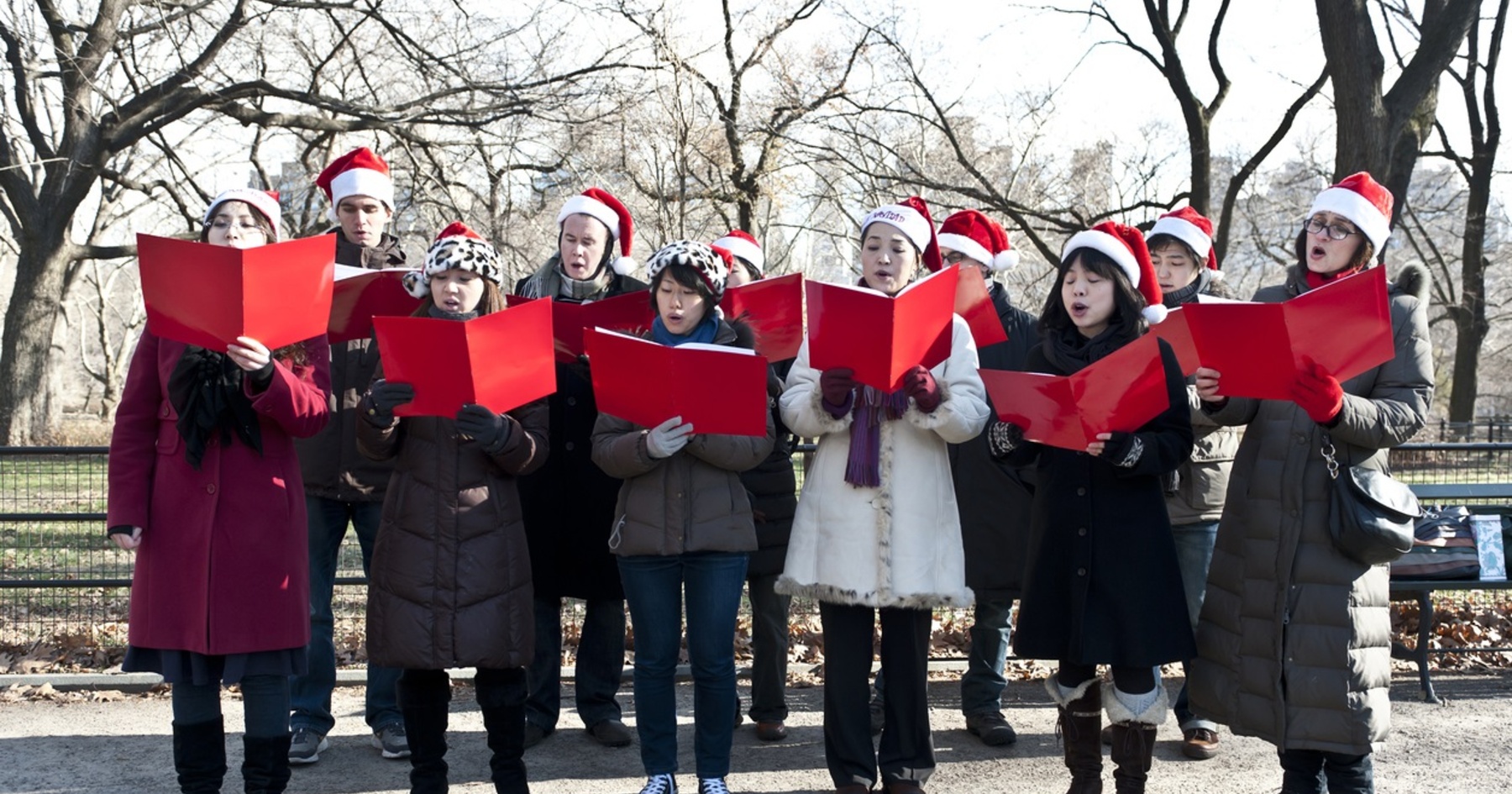 A group of people dressed up and singing.