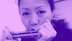 Woman playing harmonica