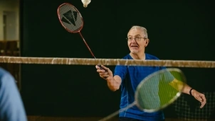 Man playing badminton