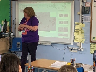 A woman speaking in a classroom